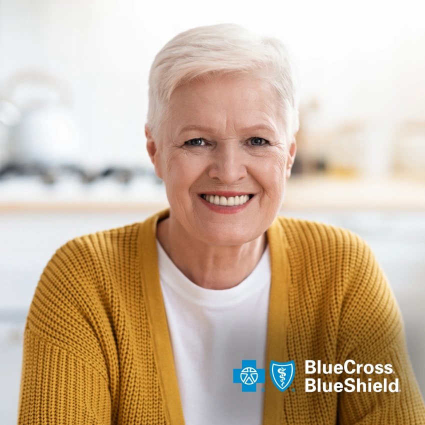 Smiling older adult representing Blue Cross Blue Shield dental insurance coverage.