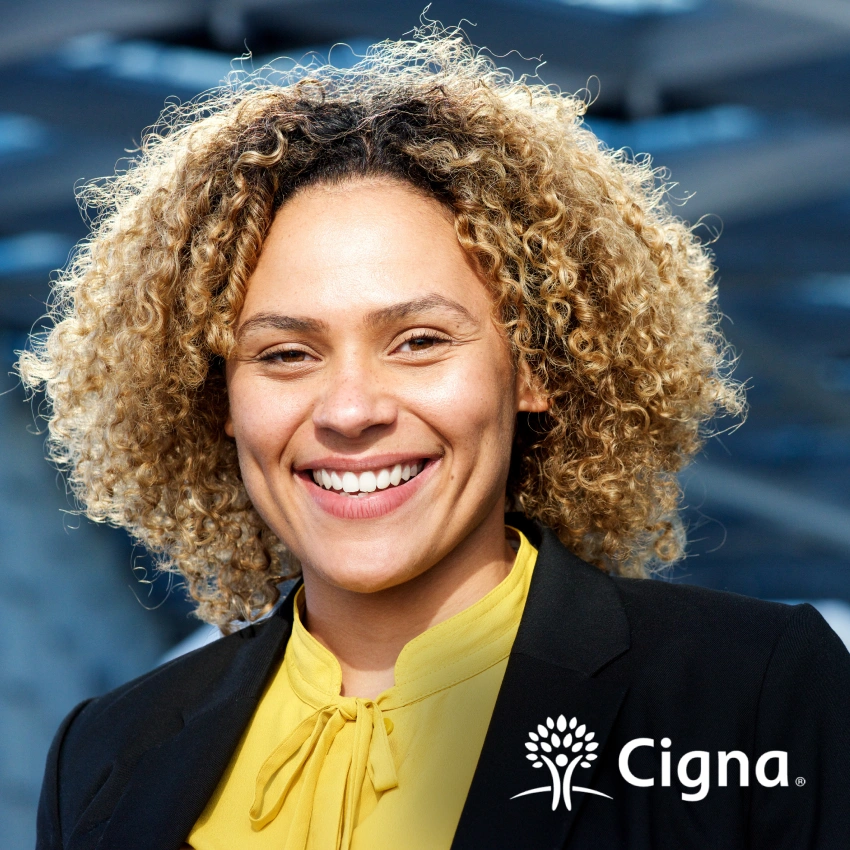 Smiling woman representing Cigna dental insurance coverage.