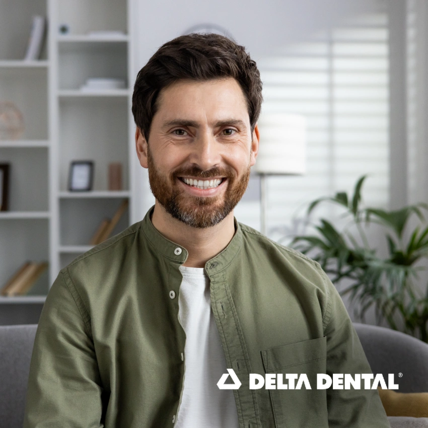 Smiling man representing Delta Dental insurance coverage.