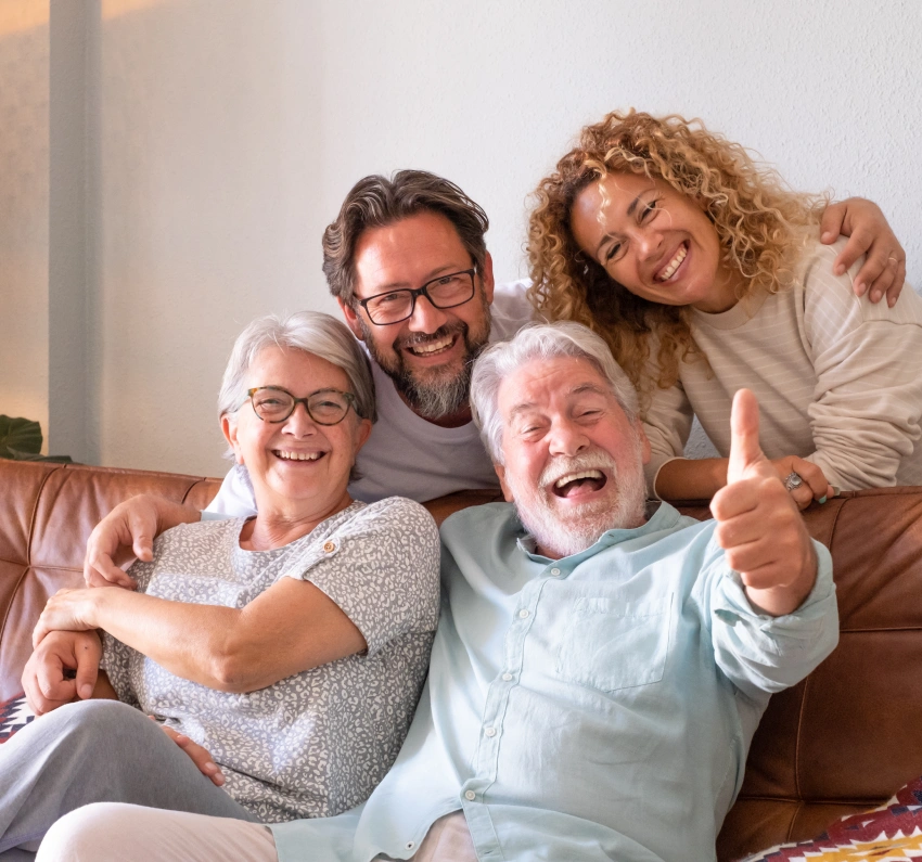 Happy multi-generational family representing lifelong dental care for all ages.