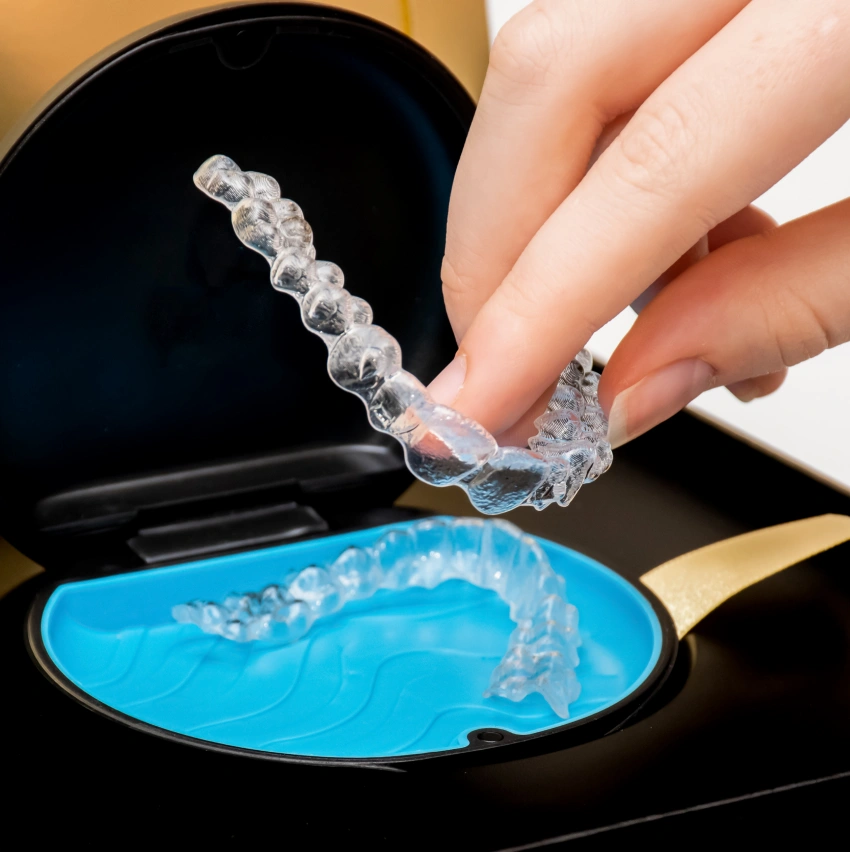 Patient smiling after Invisalign treatment at Jamaica Plain Dental