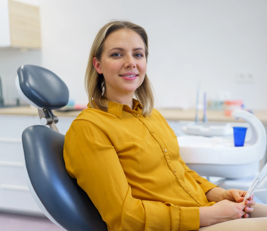 Patient seated comfortably in a treatment room at Jamaica Plain Dental